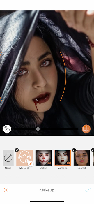 Picture of a woman holding a scarf up her head being edited by Airbrush with Makeup Filter