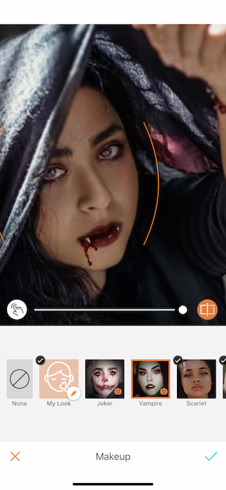 Picture of a woman holding a scarf up her head being edited by Airbrush with Makeup Filter