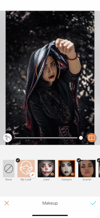 Picture of a woman holding a scarf up her head being edited by Airbrush with Makeup Filter
